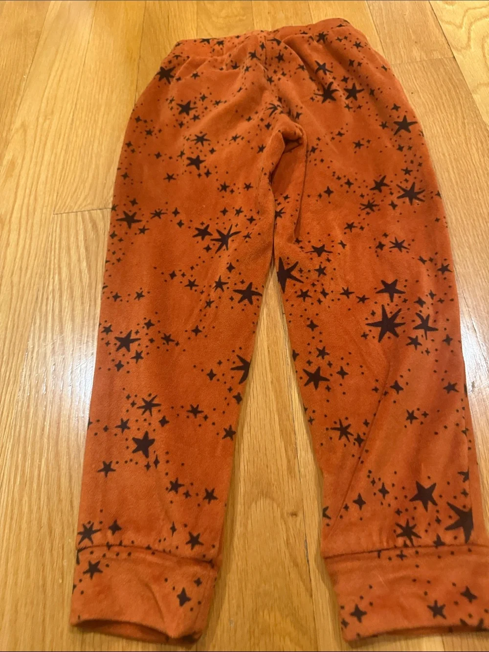 Cat & Jack rust orange velour set with black star pattern size xsmall.